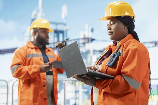 Worker using laptop software to inspect integrity of offshore platform infrastructure. Drilling rig employee using diagnostic program on notebook to detect malfunction in subsea pipelines photo