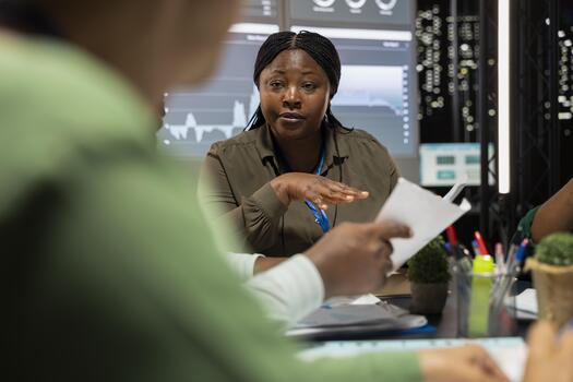 Financial experts team meeting after hours to discuss data forecasts, making a projection for resources allocation and budgeting. Coworkers training to expand the enterprise globally. photo