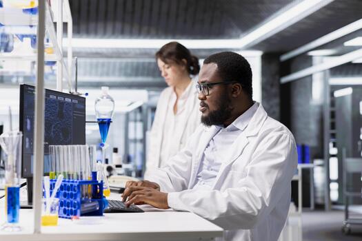 Researcher using computer application for DNA data analysis in laboratory. Research facility specialist using bioinformatics genomics software on PC in modern lab environment photo