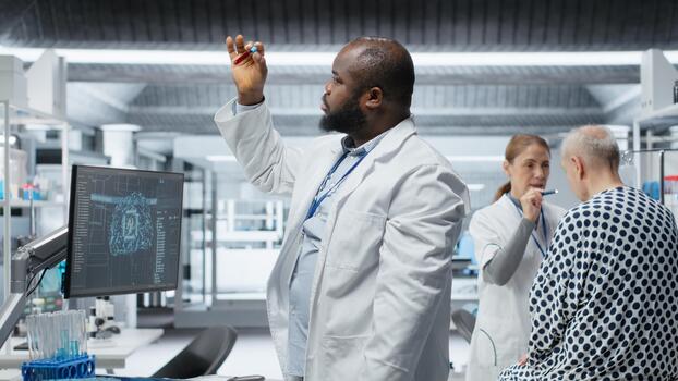 Black medic recording pharmacology data with artificial intelligence, analyzing patient reaction for a new drug testing with machine learning and neural networks. Medical progress. Camera B. photo