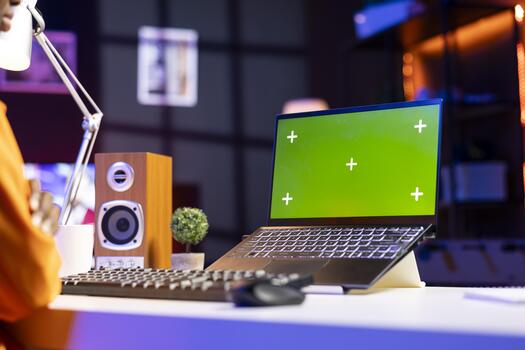 Remote employee in home office editing documents on chroma key laptop, updating reports and files, typing. Close up of isolated screen notebook used by person managing digital paperwork photo