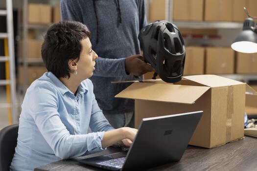 Diverse team checking order logistics for small business in house operations, small scale warehouse activity to ensure import export and distribution. Delivery service and inventory control. photo