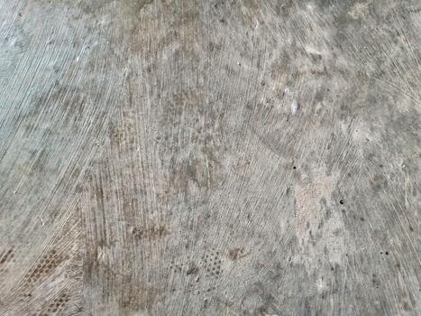 Closeup Texture of Scratched Concrete Floor Surface with Natural Patterns photo