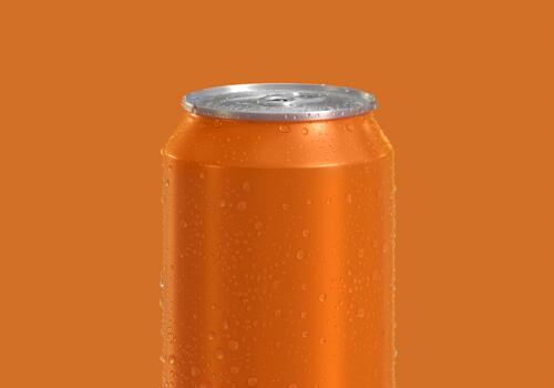 Orange Can of fresh soda with water drops on color background photo