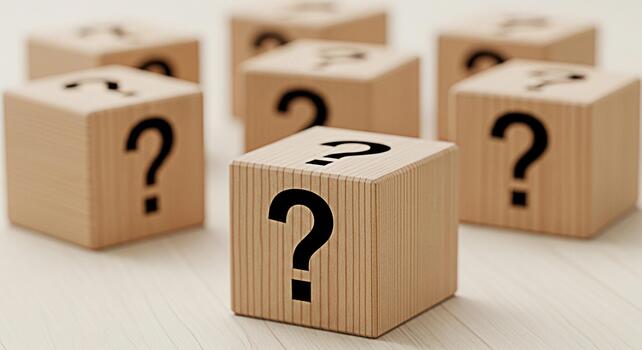 Mysterious wooden blocks displaying question marks on a bright surface symbolizing uncertainty and the unknown inviting curiosity and exploration of possibilities in a simple clean setting photo