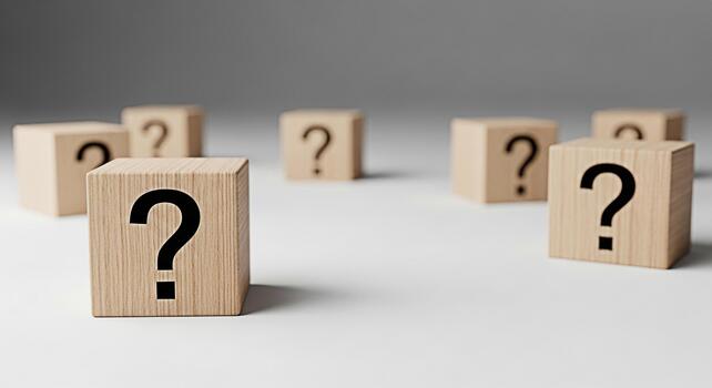Wooden blocks displaying question marks on a clean white surface symbolizing uncertainty and the need for solutions in a modern minimalist setting creating a mood of curiosity and problemsolving photo