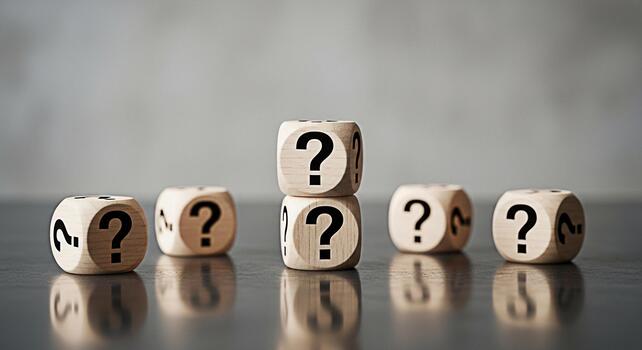 Wooden dice displaying question marks on a reflective surface symbolizing uncertainty and the search for answers in a business or educational context creating a mood of curiosity and inquiry photo