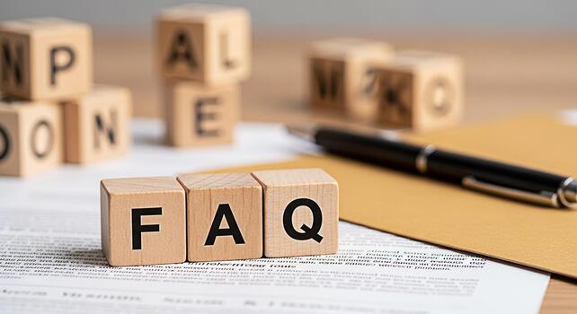 Wooden blocks spelling FAQ resting on a document with a pen in a bright office setting representing frequently asked questions information access and customer support for a helpful and informative exp photo