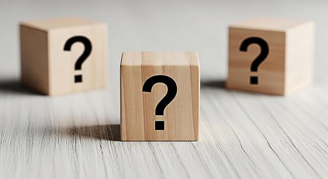 Three wooden blocks displaying question marks on a white wooden surface symbolizing uncertainty and the need for answers creating a mood of inquiry and problemsolving in a minimalist setting photo