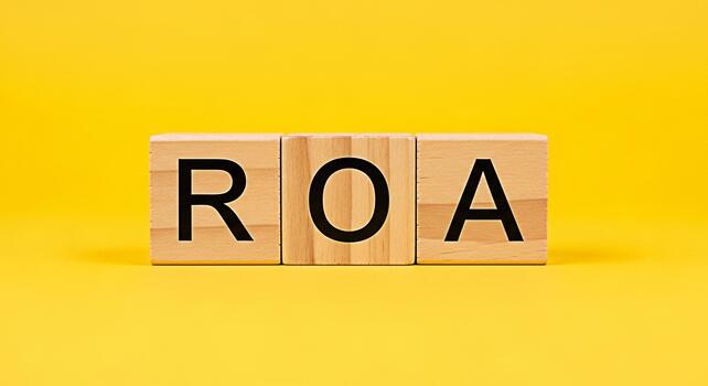 Wooden blocks displaying ROA on a vibrant yellow background symbolizing Return on Assets financial performance and investment strategy conveying a message of business success and profitability photo