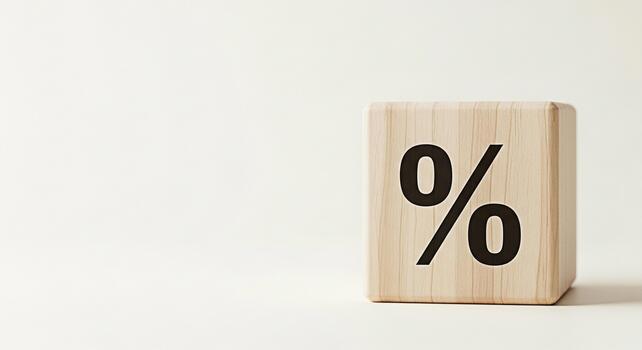Wooden block displaying a percentage sign on a clean white surface symbolizing financial rates and discounts creating a sense of simplicity and focus on key numbers for business and marketing concepts photo