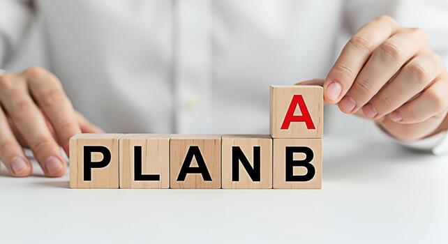 Person changing wooden blocks from Plan B to Plan A on a white table symbolizing strategic decisionmaking and adaptability in a business environment conveying a message of flexibility and problemsolvi photo