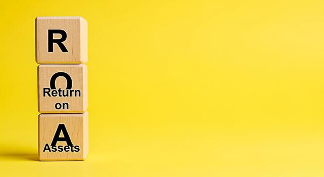 Wooden blocks displaying ROA Return on Assets against a vibrant yellow backdrop symbolizing financial performance and investment analysis creating a mood of clarity and strategic decisionmaking photo