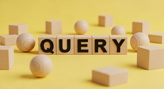 Wooden blocks spelling QUERY on a bright yellow surface surrounded by wooden spheres and cubes representing information retrieval and search engine optimization with a minimalist and clean aesthetic photo