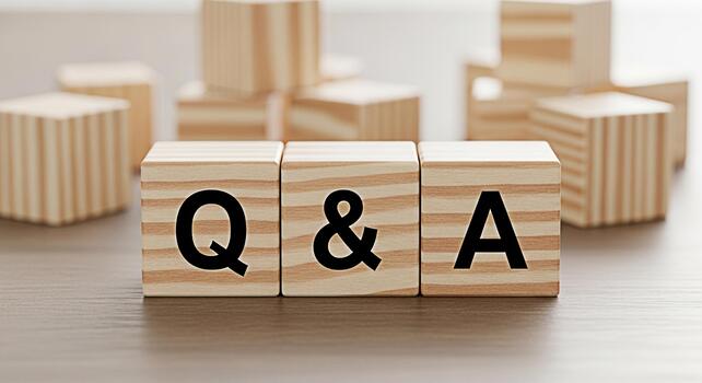Wooden blocks spelling out Q A on a wooden surface representing a question and answer session knowledge sharing and interactive learning in a bright and minimalist setting photo