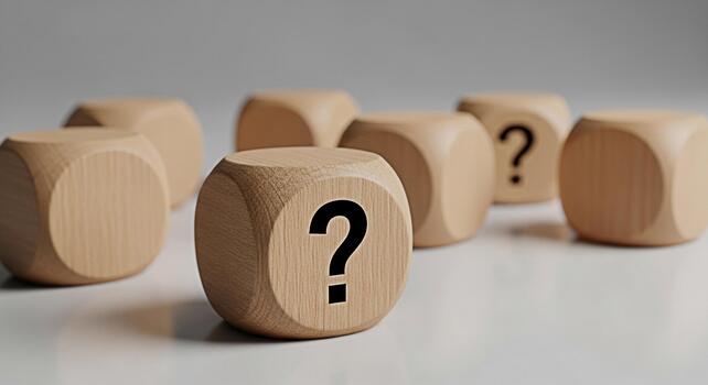Wooden dice displaying question marks on a white surface symbolizing uncertainty and the need for answers in a complex world creating a sense of mystery and intrigue photo