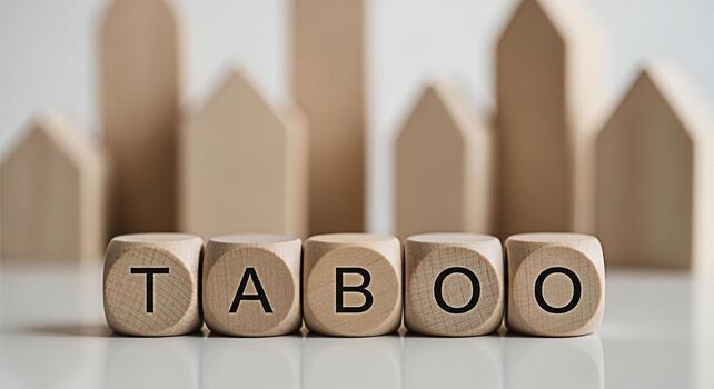Wooden blocks spelling TABOO in a minimalist setting representing forbidden topics and boundaries creating a sense of mystery and intrigue ideal for discussions on social norms and cultural sensitivit photo