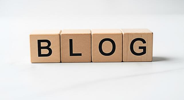 Wooden blocks spelling BLOG on a clean white surface representing online content creation and sharing conveying a message of information connection and digital communication in a minimalist setting photo