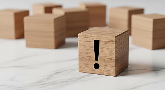 Wooden cube displaying an exclamation mark on a marble surface symbolizing urgency and attention to detail in a minimalist and modern setting conveying a sense of importance and problemsolving photo