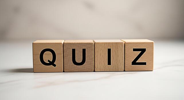 Wooden blocks spelling QUIZ on a marble surface inviting participation and knowledge testing in an educational and engaging environment promoting learning and intellectual stimulation photo