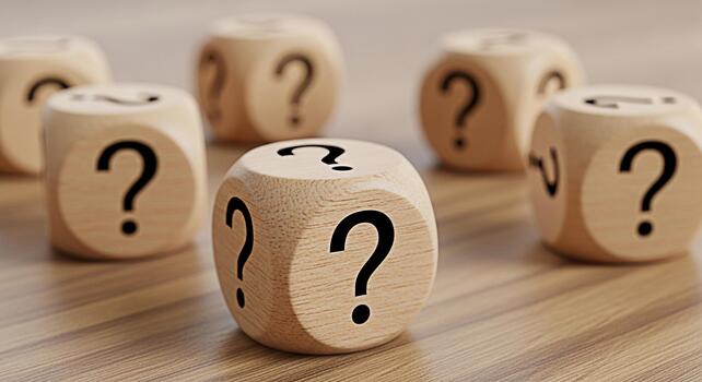 Wooden dice displaying question marks on a wooden surface representing uncertainty and the need for answers in a complex problemsolving environment creating a sense of mystery and intrigue photo