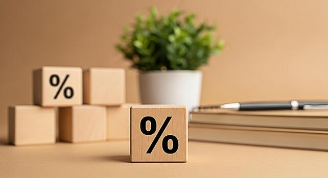 Wooden blocks displaying percentage signs on a desk with a notebook and pen representing financial rates and discounts in a business setting creating a sense of opportunity and savings photo
