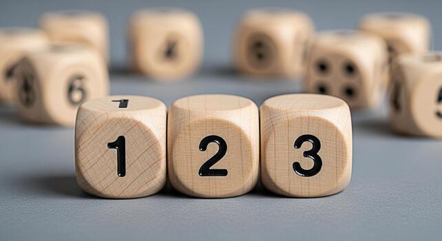 Wooden dice displaying numbers one two and three on a gray surface suggesting sequence order and progression in a learning or game setting creating a playful and educational mood photo