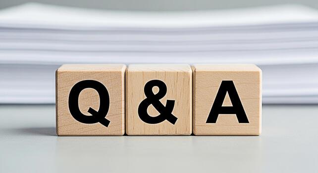 Wooden blocks displaying QA on a table symbolizing questions and answers in a business environment creating a clear and concise message for information and knowledge sharing photo