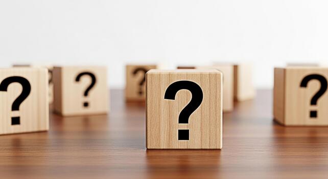 Wooden blocks displaying question marks on a wooden table symbolizing uncertainty and the need for answers in a business or educational setting creating a mood of curiosity and problemsolving photo