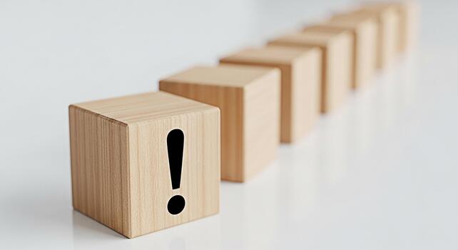 Wooden blocks displaying an exclamation mark in a minimalist setting symbolizing urgency and attention to detail conveying a sense of importance and the need for careful consideration on a clean white photo