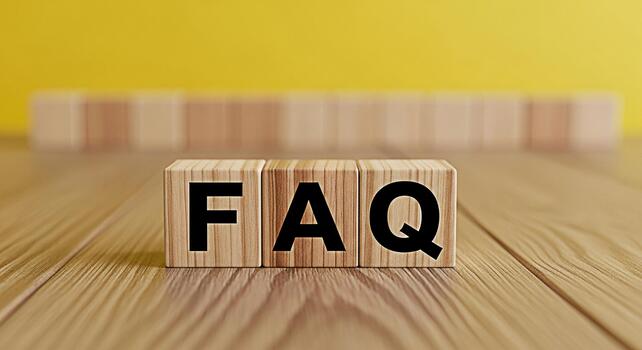 Wooden blocks displaying FAQ on a wooden surface against a yellow background representing frequently asked questions and providing helpful information with a clear and concise message photo