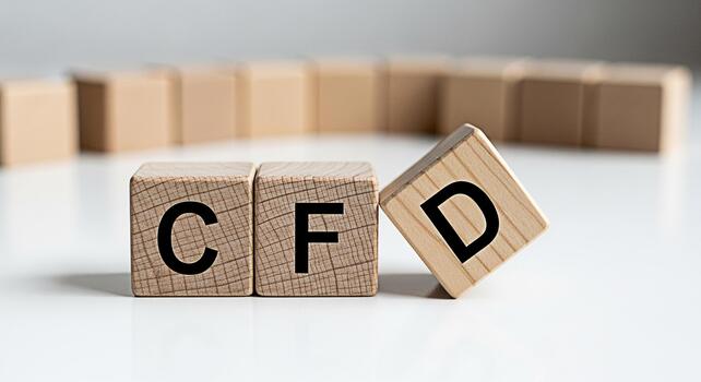 Wooden blocks spelling CFD on a white surface representing Contracts for Difference in a financial setting conveying a sense of business acumen and investment strategy photo