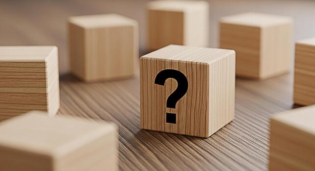 Wooden block displaying a question mark on a wooden surface surrounded by other blocks symbolizing uncertainty problemsolving and the search for answers in a conceptual and minimalist setting photo