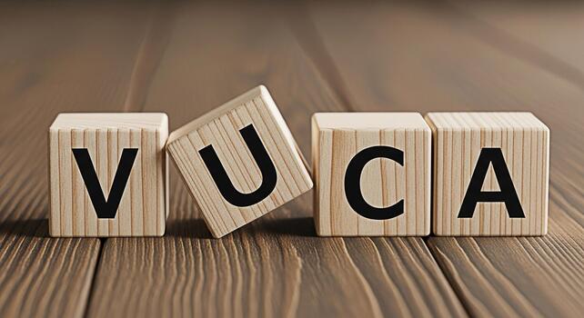 Wooden blocks spelling VUCA on a wooden surface representing Volatility Uncertainty Complexity and Ambiguity in a business context symbolizing challenges and strategic decisionmaking in a dynamic envi photo