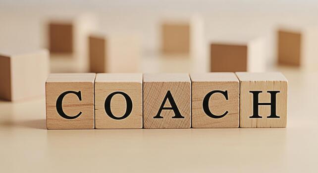 de madera bloques ortografía fuera entrenador en un neutral superficie representando Guia y apoyo en un aprendizaje ambiente Fomentando un sentido de tutoría y profesional desarrollo con un atención en crecimiento foto