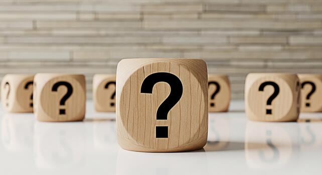 Wooden dice displaying question marks on a white surface against a textured wall symbolizing uncertainty and the need for answers in business education and personal life creating a sense of curiosity photo