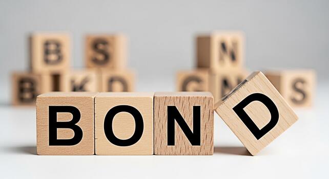 Wooden blocks spelling BOND on a white surface symbolizing financial security and commitment representing trust and stability in a clean minimalist setting conveying a sense of reliability and assuran photo