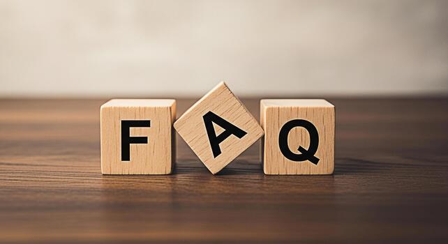 Wooden blocks spelling FAQ on a wooden surface representing frequently asked questions providing information and support creating a sense of clarity and guidance for users seeking answers photo