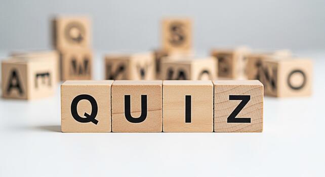 Wooden blocks spelling QUIZ on a white surface inviting participation in a fun and engaging trivia game promoting knowledge learning and intellectual stimulation in a playful environment photo