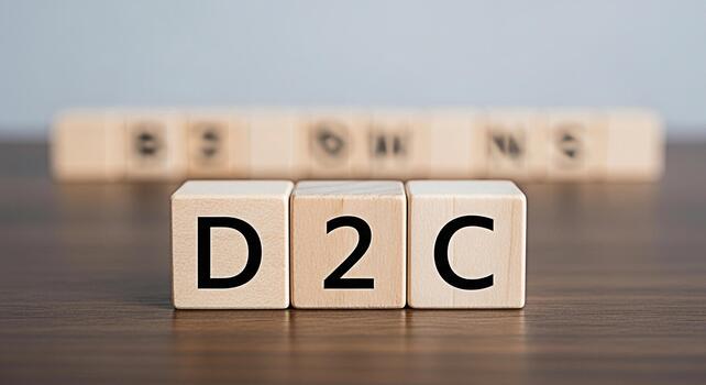 Wooden blocks spelling out D2C on a wooden table representing a directtoconsumer business model showcasing modern retail and ecommerce strategies conveying a sense of innovation and business growth photo