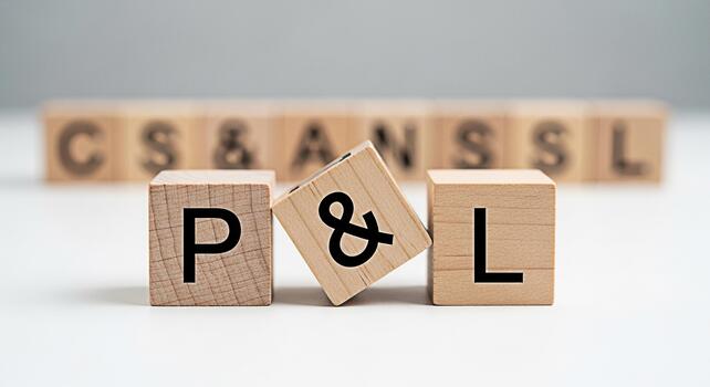 Wooden blocks displaying P L on a white surface representing Profit and Loss statements in a clean minimalist setting conveying financial reporting and business performance analysis photo