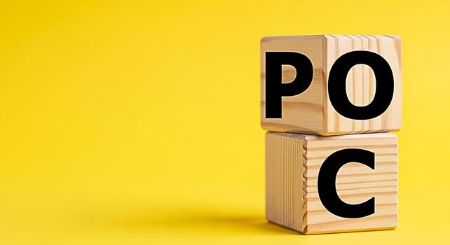 Wooden blocks displaying POC on a bright yellow background representing Proof of Concept in a minimalist and clean setting symbolizing validation and feasibility assessment for business strategies photo