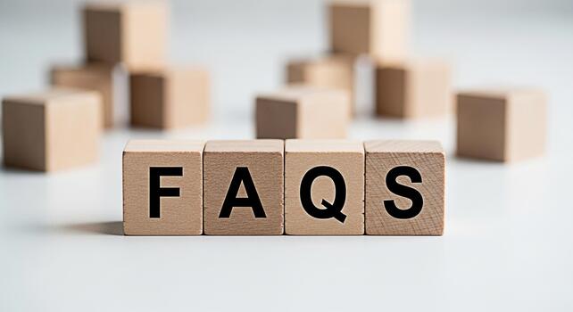 Wooden blocks spelling FAQs on a white surface representing frequently asked questions in a clean and minimalist setting conveying clarity and information photo