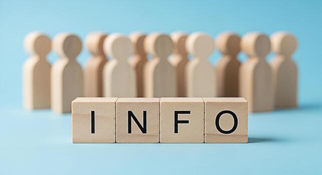 Wooden figures standing behind wooden blocks spelling INFO on a blue surface representing information knowledge and data sharing in a simple and minimalist style for business and education photo