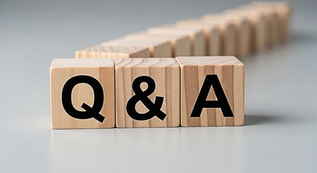 Wooden blocks displaying Q A in a bright studio setting representing questions and answers knowledge sharing and the importance of information exchange in a clear and concise manner photo
