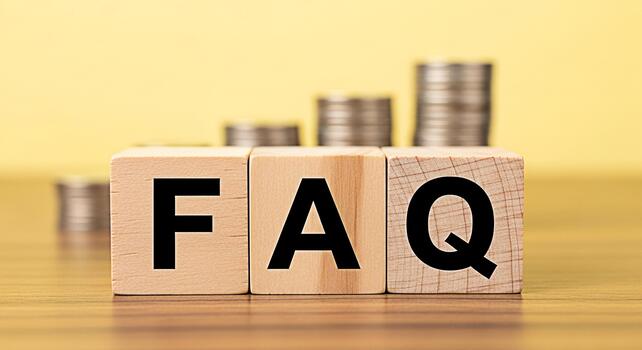 Wooden blocks displaying FAQ on a wooden surface with stacked coins in the background representing frequently asked questions about finance investment and financial planning with a clear and informati photo