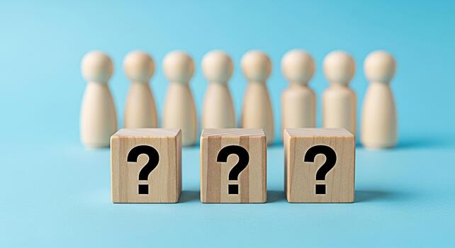 Wooden figures standing behind question mark blocks on a blue surface representing uncertainty and the need for answers in business decisionmaking and problemsolving creating a sense of curiosity photo