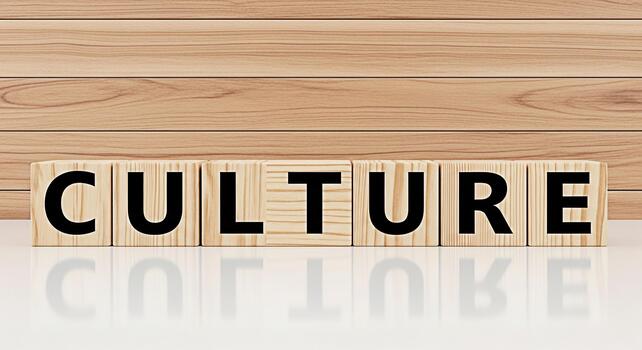 Wooden blocks spelling CULTURE on a reflective surface against a wood panel background symbolizing diversity inclusion and the importance of a positive and supportive work environment photo