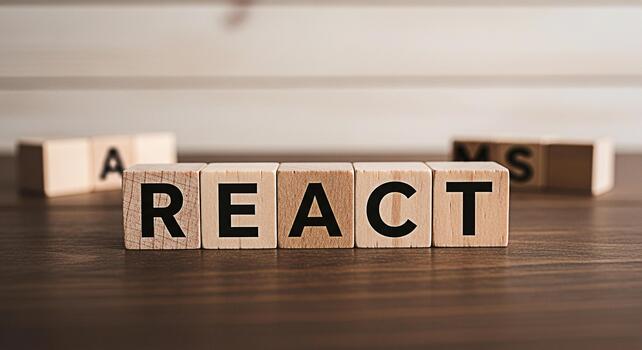 Wooden blocks spelling REACT on a dark wooden table showcasing a popular JavaScript library for building user interfaces conveying a modern and innovative concept in web development photo