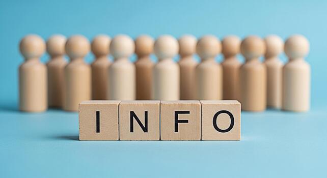 Wooden figures standing behind blocks spelling INFO on a blue surface representing information knowledge and data dissemination in a clear and concise manner promoting understanding and awareness photo